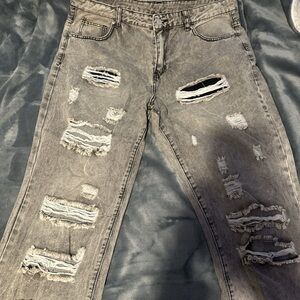 Distressed and Stacked Gray Jeans for Men